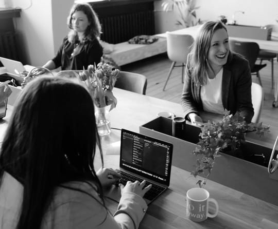 three women in a workspace